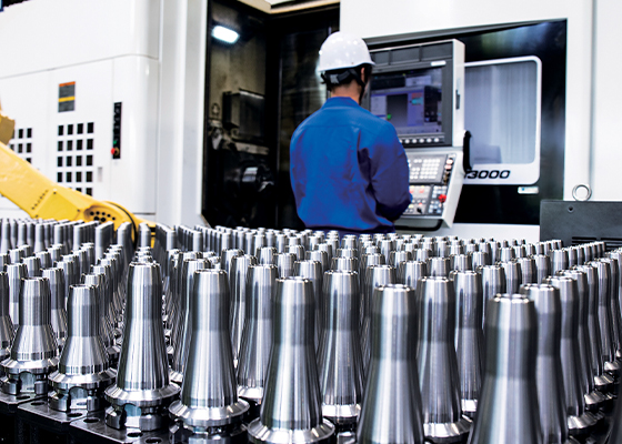 Tool holders in front of a CNC machine.