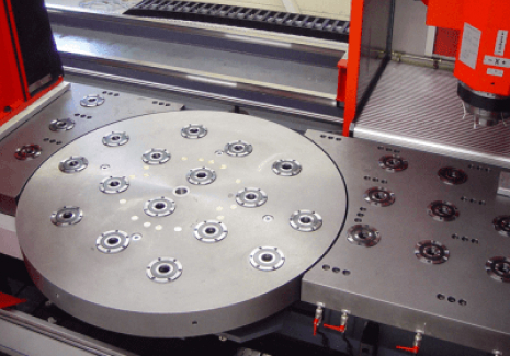 UNILOCK round chucks for workholding installed on a rotating round table.